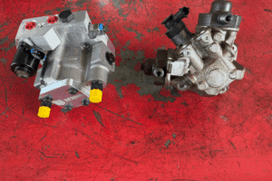 DCR vs CP4. Powerstroke diesel engine repair in Goldsboro, NC by Archie & Sons Diesel Repair. Image of a new S&S Diesel DCR pump next to a failed CP4 pump.